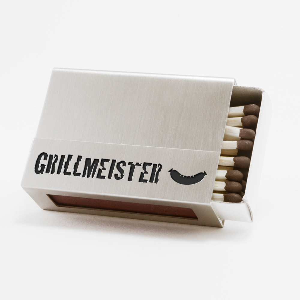 Streichholzschachtel - Huelle "Grillmeister" aus Edelstahl mit schwarzer Schrift und schwarzer Grillwurst